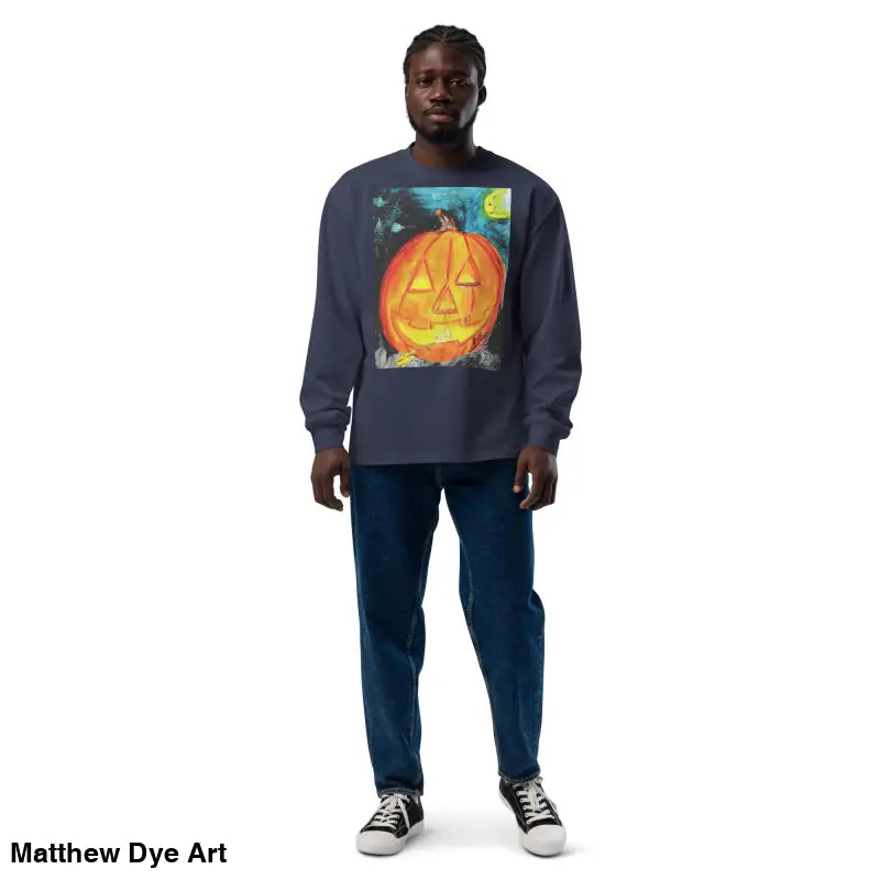 Man wearing a Pumpkin Mischief long sleeve featuring Matthew Dye Art’s whimsical Jack-o’-Lantern