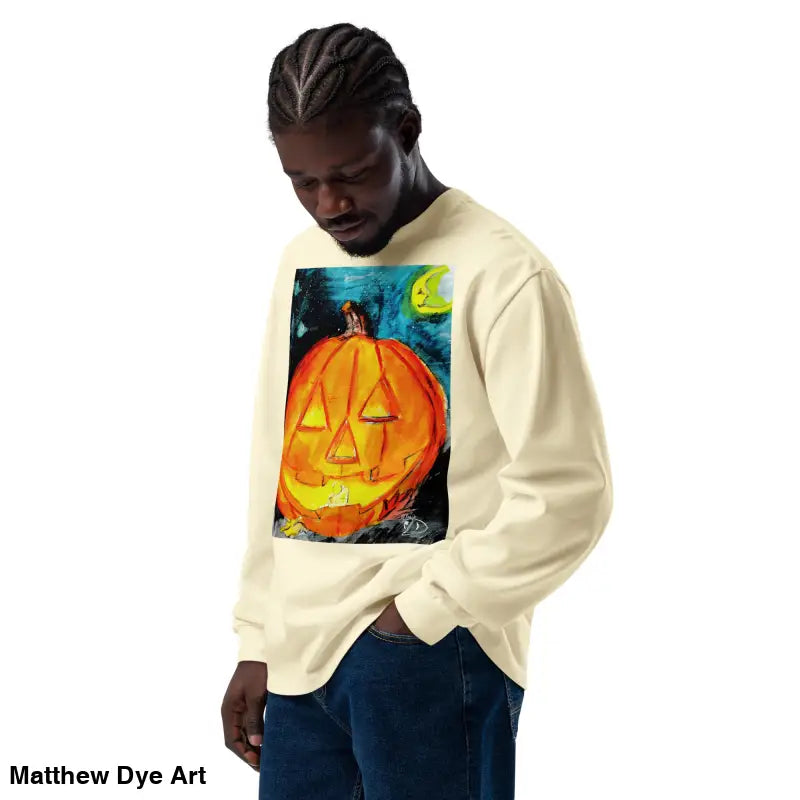 Man in Pumpkin Mischief sweatshirt featuring Matthew Dye Art’s whimsical jack-o’-lantern design