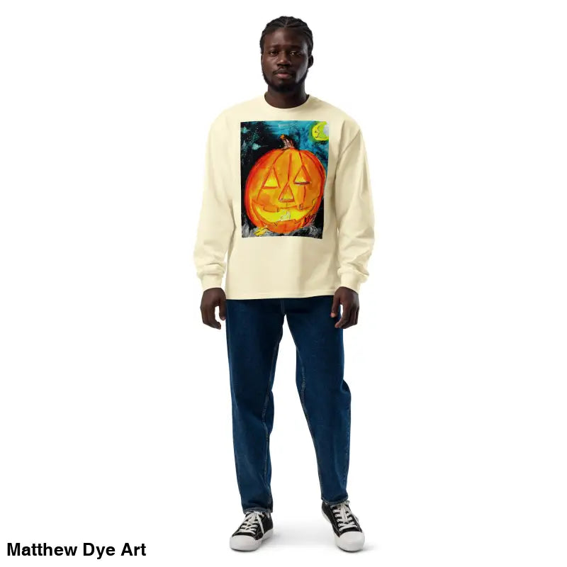 Man wearing a Pumpkin Mischief sweatshirt featuring Matthew Dye Art’s whimsical Jack-o’-Lantern