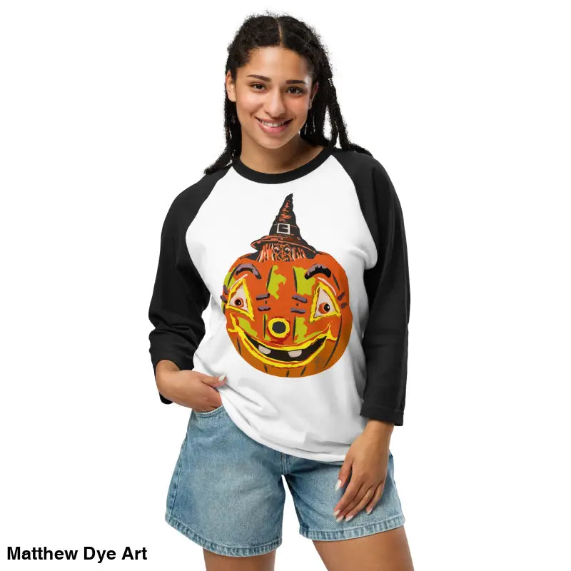 Woman in stylish raglan shirt featuring charming retro Halloween design with pumpkins