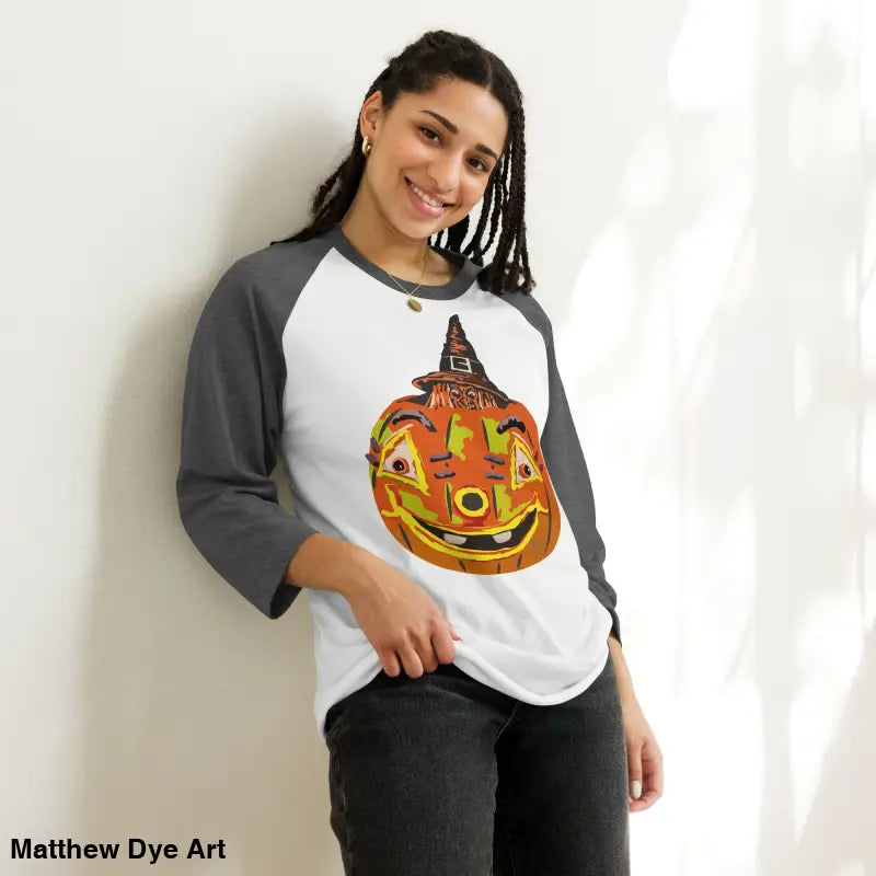 Stylish raglan shirt featuring charming retro Halloween design with a pumpkin witch