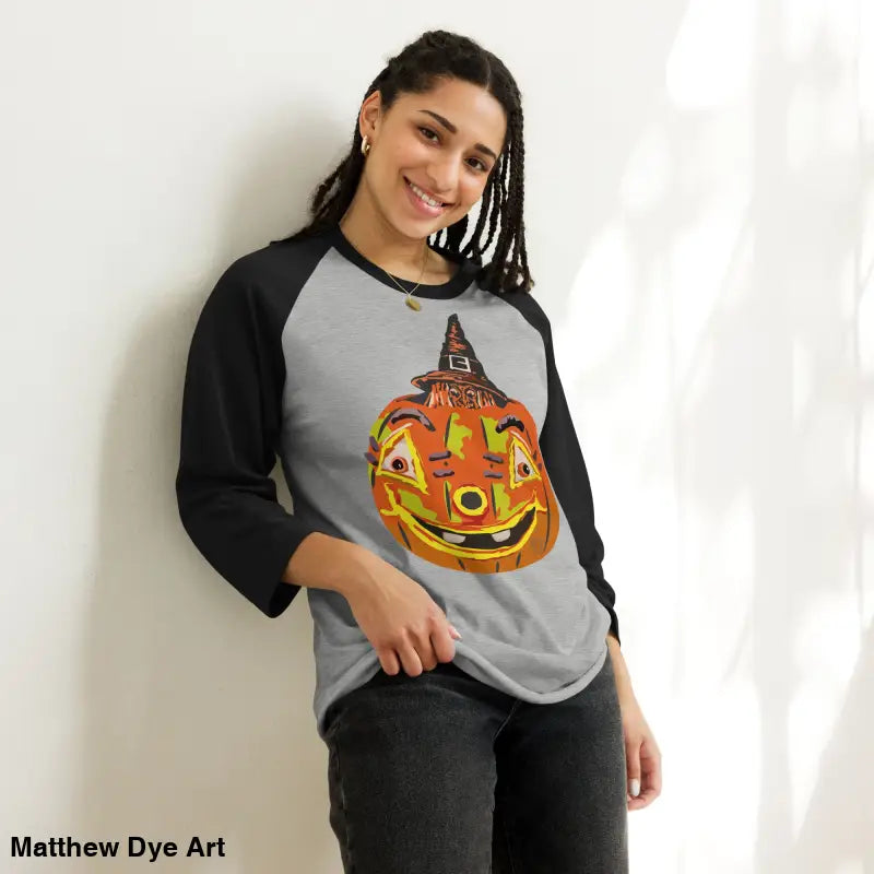 Stylish raglan shirt featuring charming retro Halloween design with pumpkin and witch elements