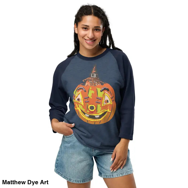 Woman wearing a stylish raglan shirt with retro Halloween flair featuring pumpkin witch design
