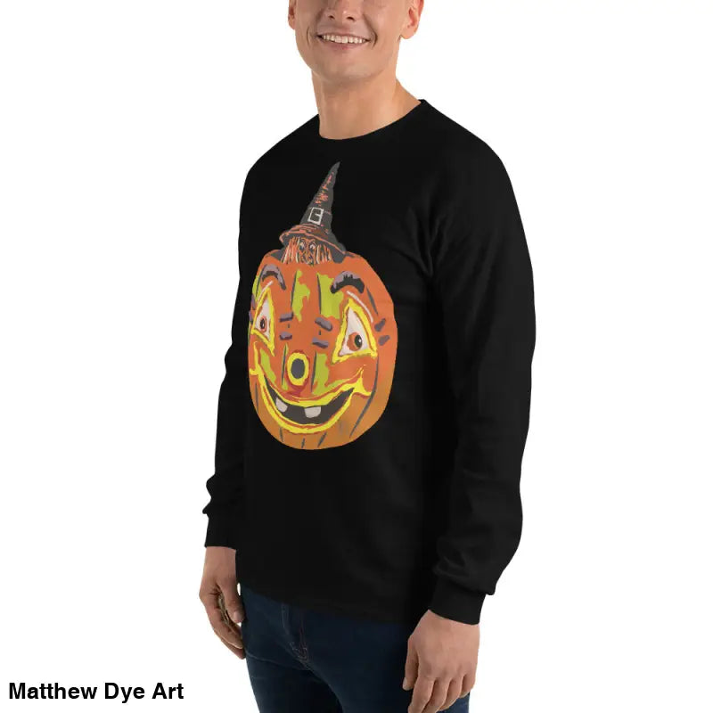 Black long-sleeved shirt featuring whimsical pumpkin graphic from Pumpkin Witch Men’s collection