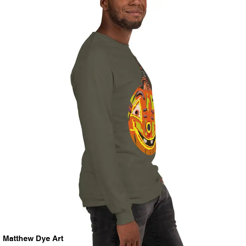 Olive green long-sleeved Pumpkin Witch Men’s shirt featuring a whimsical pumpkin face