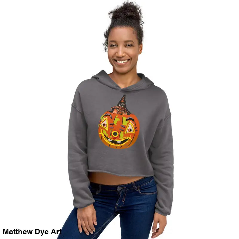 Woman in gray cropped hoodie featuring a vintage Halloween pumpkin design