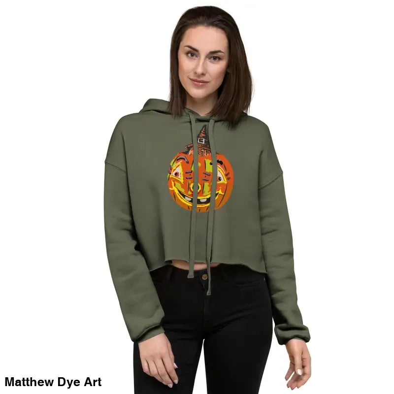 Woman in a cropped Pumpkin Witch Spellbound Halloween hoodie featuring an enchanted pumpkin design