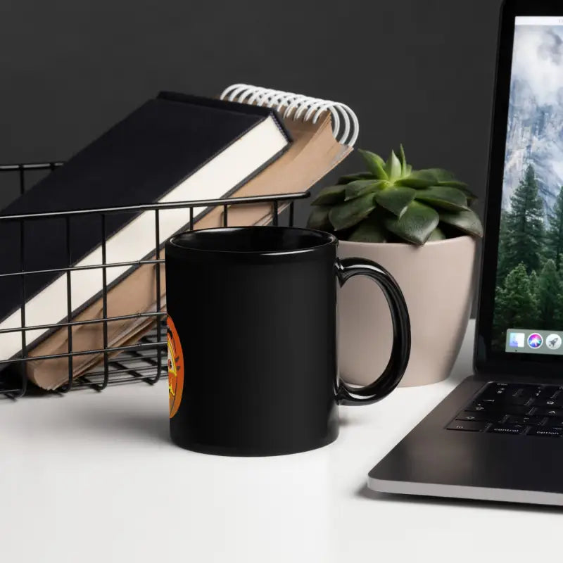 Black ceramic mug from Pumpkin Witch, featuring a glossy brew design for Halloween