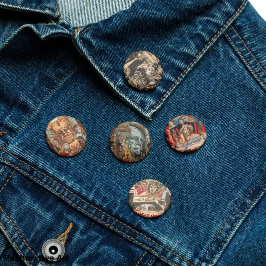 Vintage-looking horror enamel pins displayed on denim fabric for Scream Worthy Pins collection