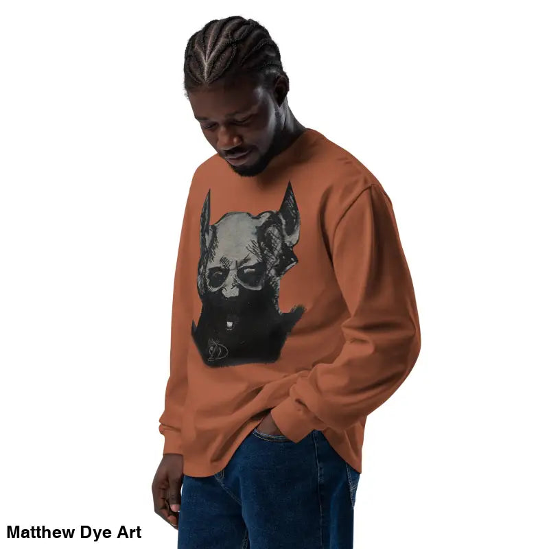 Orange premium long sleeve sweatshirt featuring a skull graphic for a sinister look
