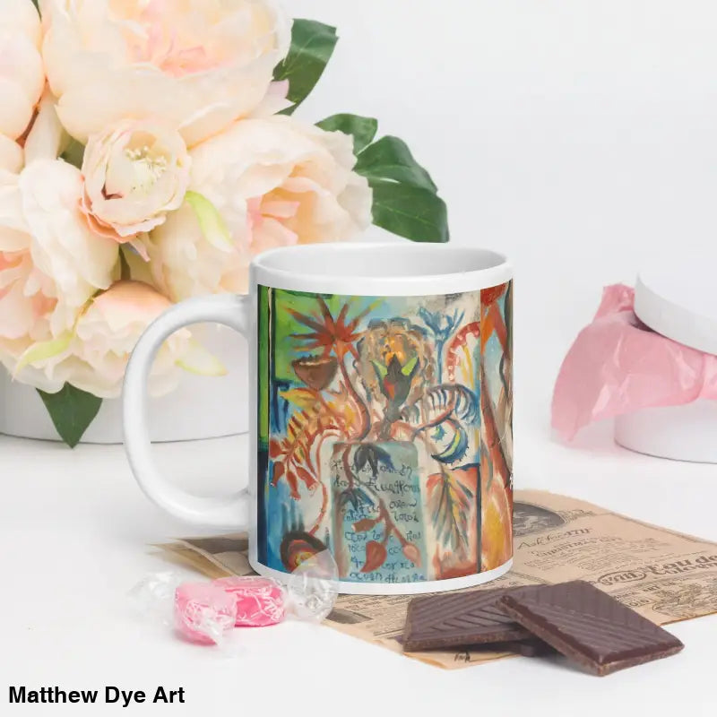 White ceramic mug with vibrant tropical art design from Voynich Ceramic Mug collection