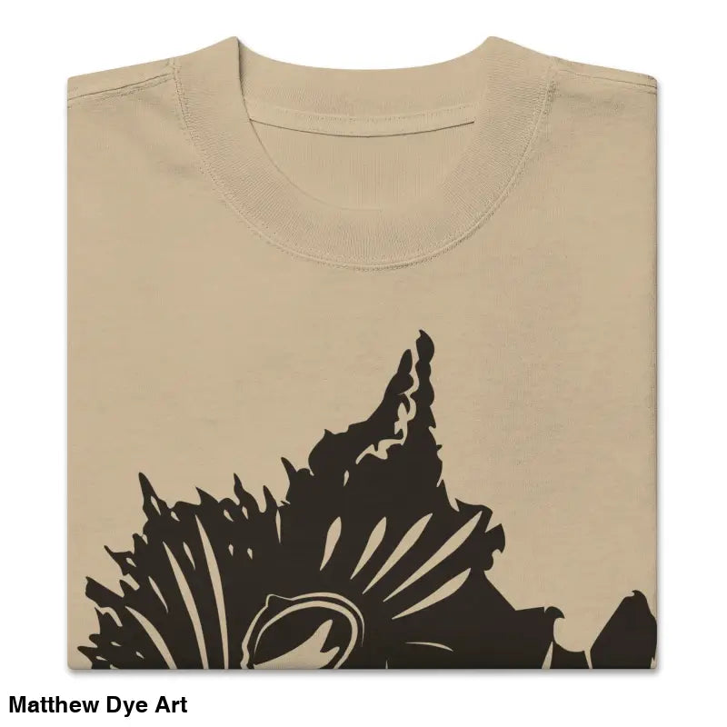 Folded beige oversized faded t-shirt featuring dark floral design from Snarling Nightmare