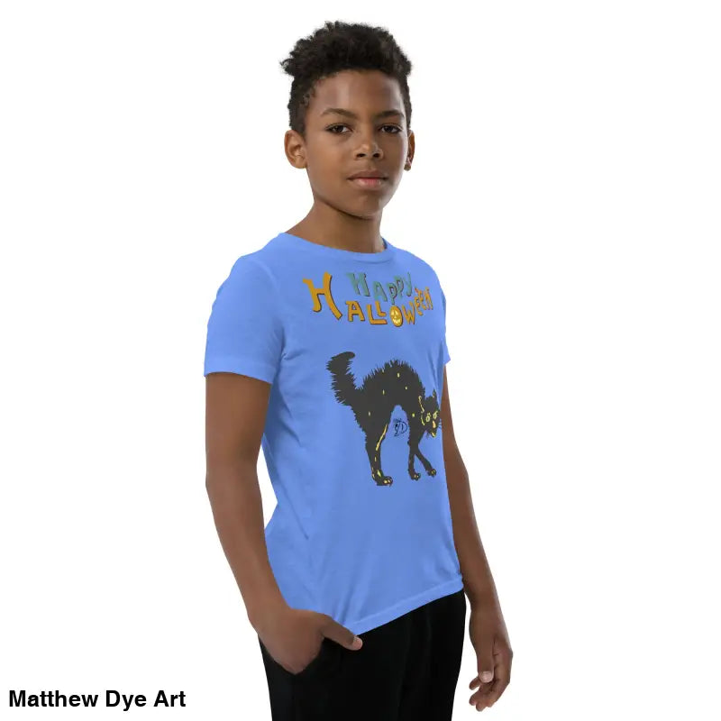 Boy wearing blue youth Halloween short sleeve t-shirt featuring happy Halloween black cat design