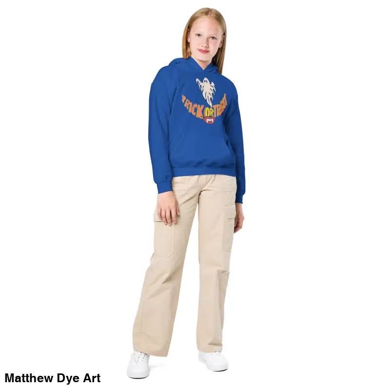 Girl in a blue hoodie from Spooktacular Smiles for a stylish child’s Halloween wardrobe