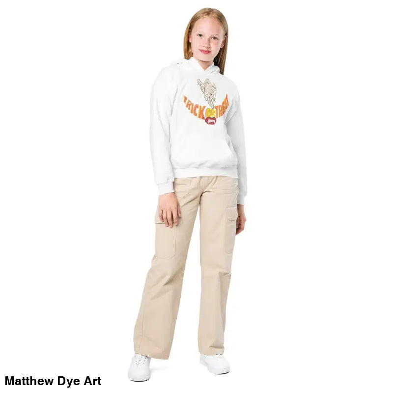 Girl wearing a white hoodie and khaki pants in a Spooktacular Smiles Halloween Hoodie