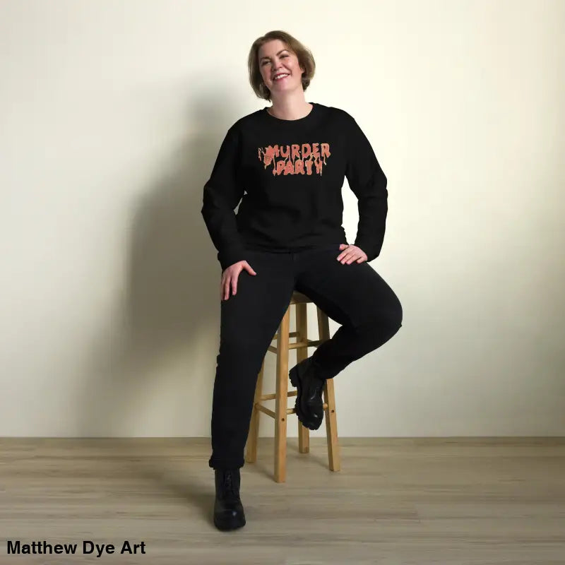 Woman wearing eco-friendly Murder Party sweatshirt and pants in black attire