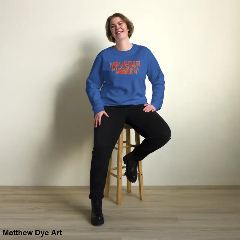 Woman wearing a blue eco-friendly Murder Party sweatshirt and black pants