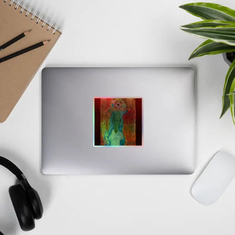 Silver laptop adorned with mesmerizing holographic vinyl stickers of The Priestess