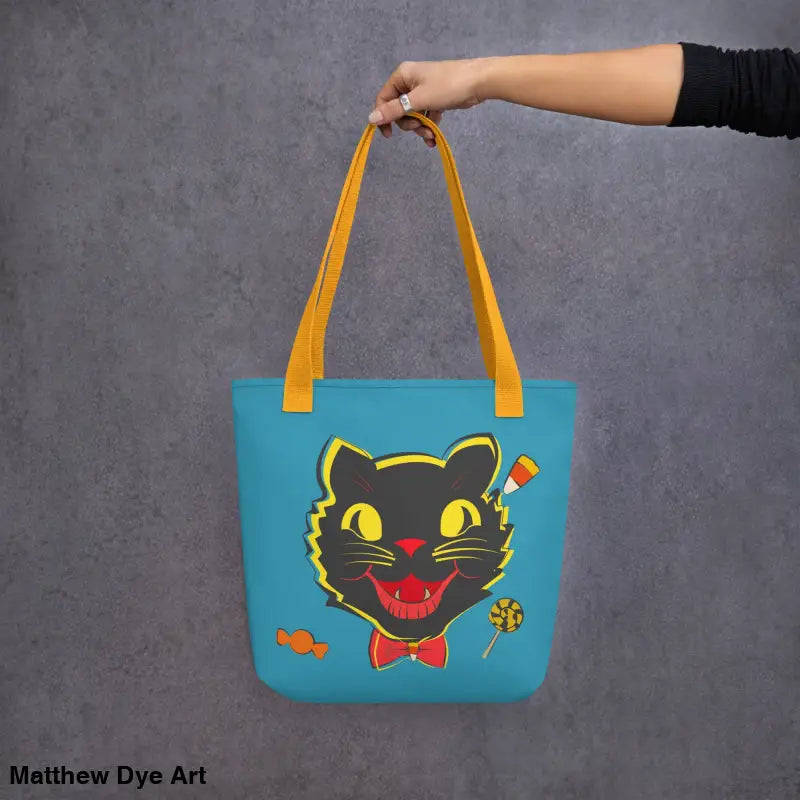Blue tote bag featuring vintage black cat design for trick-or-treating in style