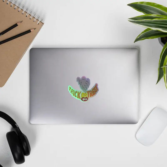 Laptop adorned with Trick or Treat Smiles Holographic Stickers by Matthew Dye Art