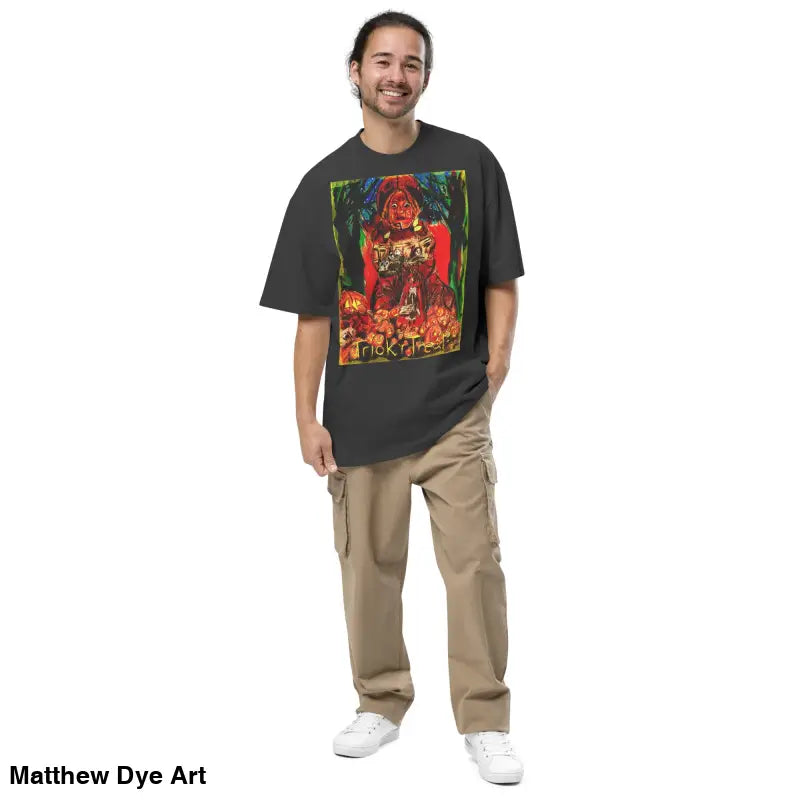 Man in graphic tee and cargo pants featuring haunting jack-o’-lantern art for Trick ’r Treat