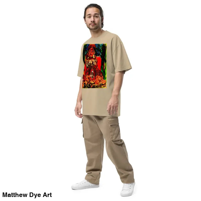 Man in beige t-shirt and cargo pants modeling Trick ‘r Treat Halloween Tee with art