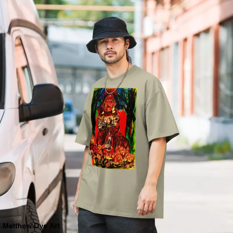 Man in graphic tee and bucket hat showcasing Trick ‘r Treat Mayhem Halloween design