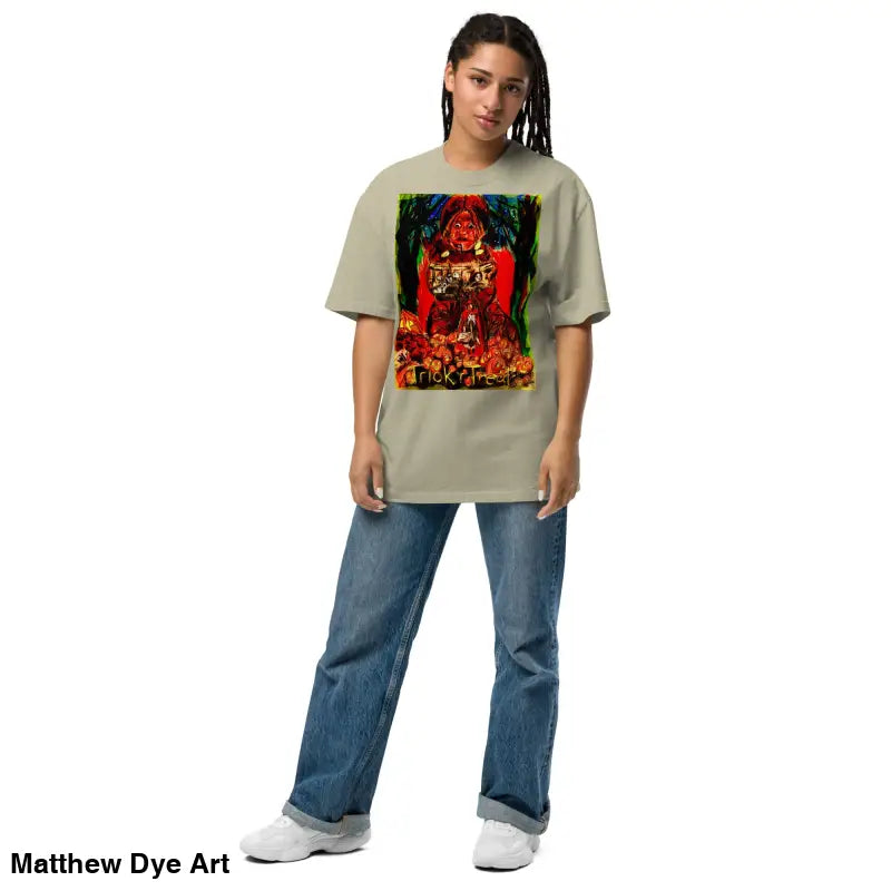 Woman in oversized faded Halloween tee featuring haunting jack-o’-lantern design