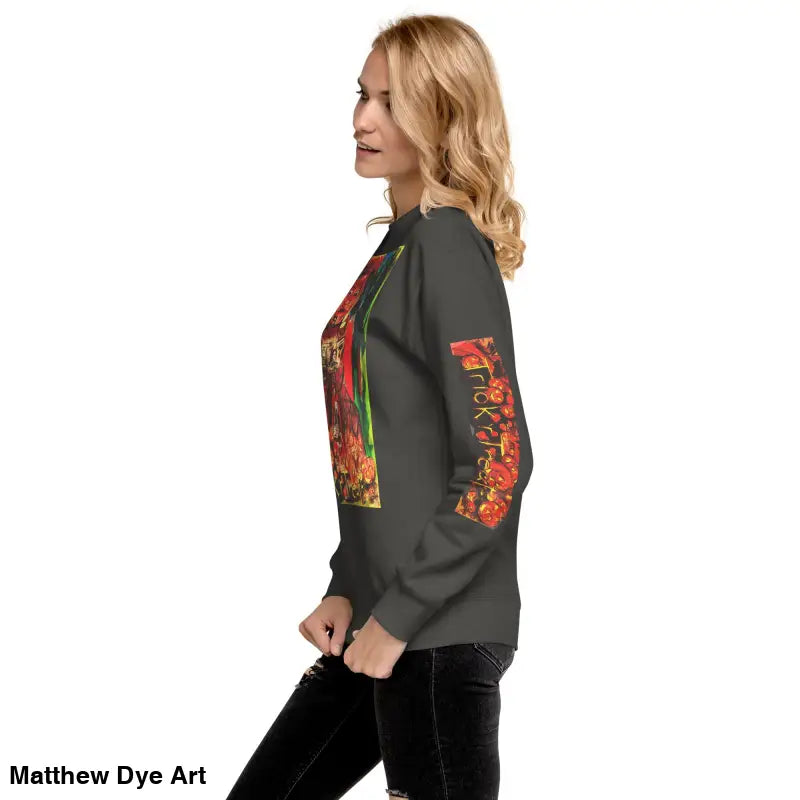 Woman wearing a Trick ’r Treat unisex premium sweatshirt featuring a stylish pattern