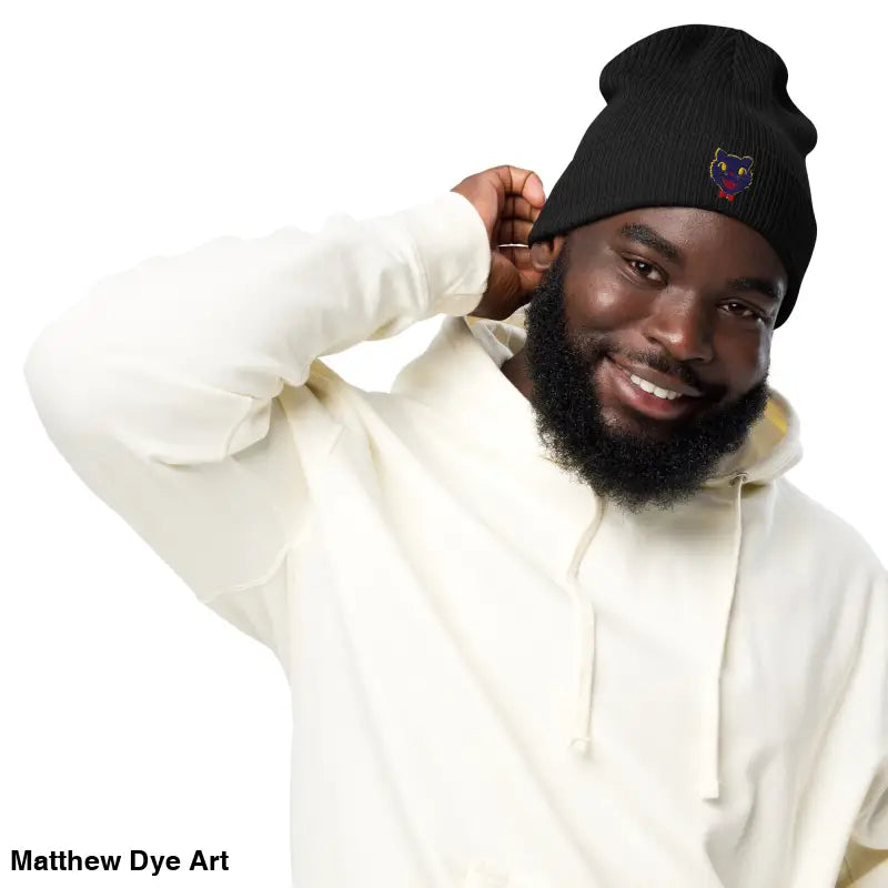 Black knitted beanie featuring a colorful vintage Halloween cat emblem for unisex wear