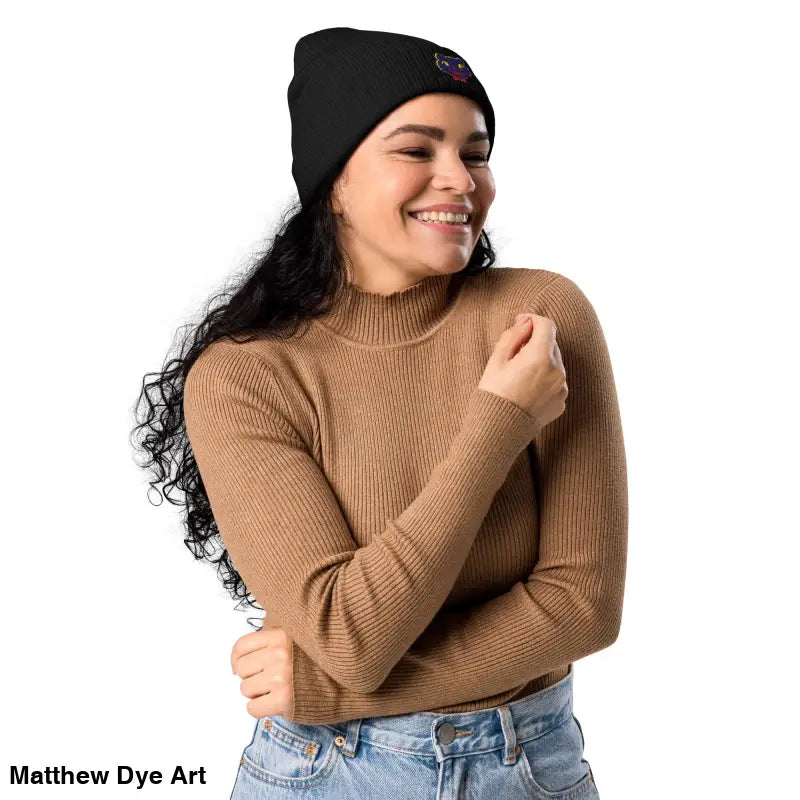 Black knit beanie with embroidered patch, featuring a vintage Halloween cat design