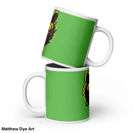 Two stacked green ceramic mugs with black and yellow designs for serene moments