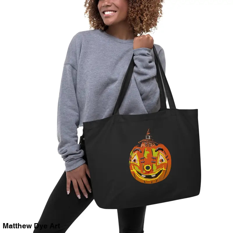 Black tote bag featuring Vintage Pumpkin Witch design for Halloween trick or treat