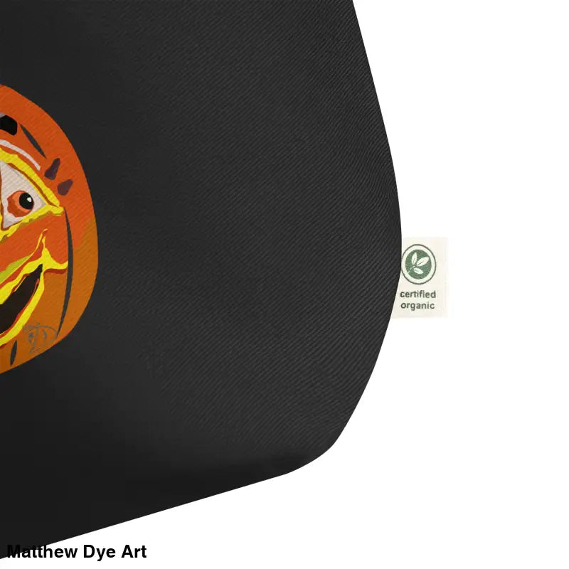Black tote bag featuring a vintage pumpkin witch design for Halloween trick or treat
