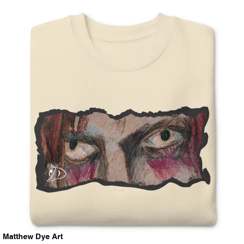 Folded cream-colored sweatshirt with eye graphic, a timeless piece enriched with urban elegance