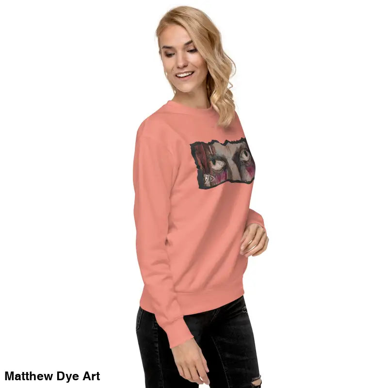 Salmon-colored Watcher’s Gaze Unisex Sweatshirt combines urban elegance and classic sweatshirt silhouette