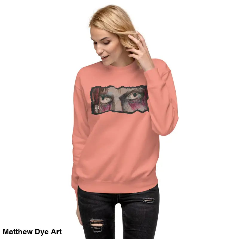 Peach-colored sweatshirt with eye graphic, a timeless piece enriched in urban elegance