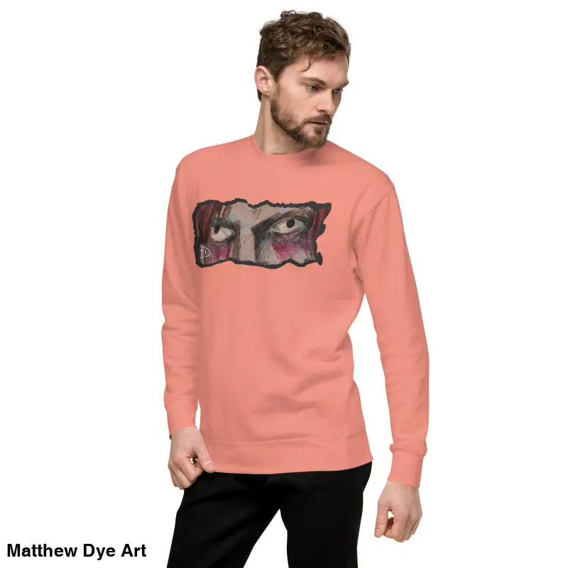 Salmon-colored long-sleeved shirt featuring eye graphic in classic sweatshirt silhouette