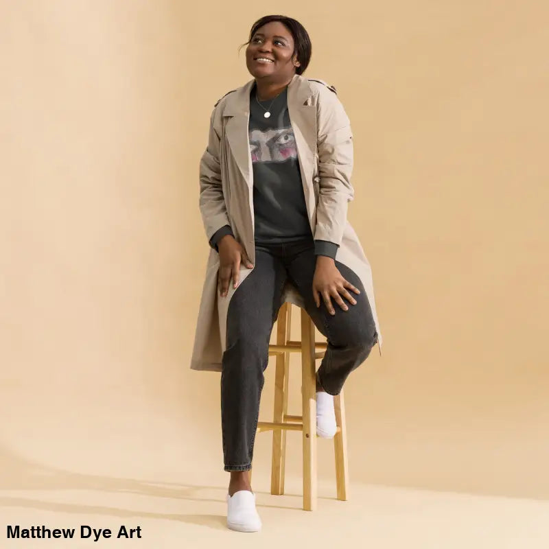 Woman showcasing urban elegance in Watcher’s Gaze unisex sweatshirt, a timeless piece enriched