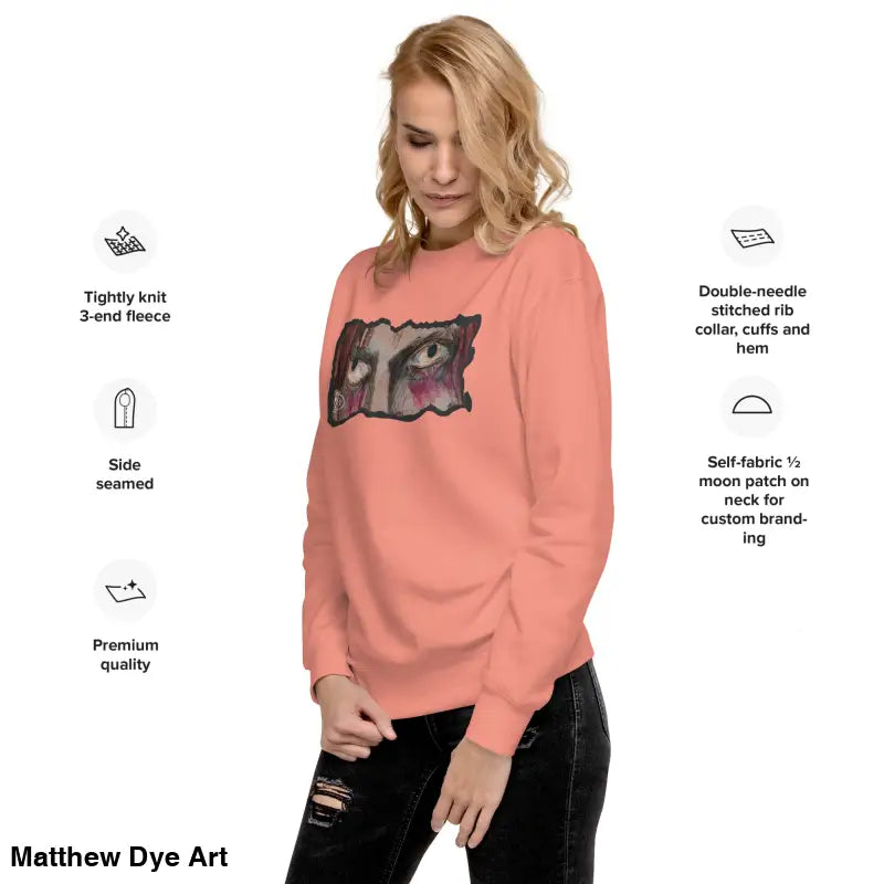 Salmon-colored sweatshirt featuring eye graphic, a timeless piece enriched with urban elegance