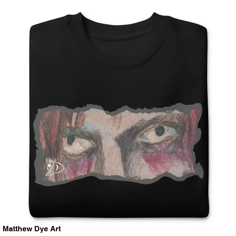 Folded black sweatshirt featuring eye graphic, a timeless piece enriched with urban elegance