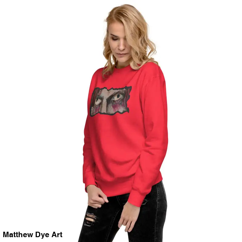 Red sweatshirt featuring an eye graphic, a timeless piece enriched with urban elegance