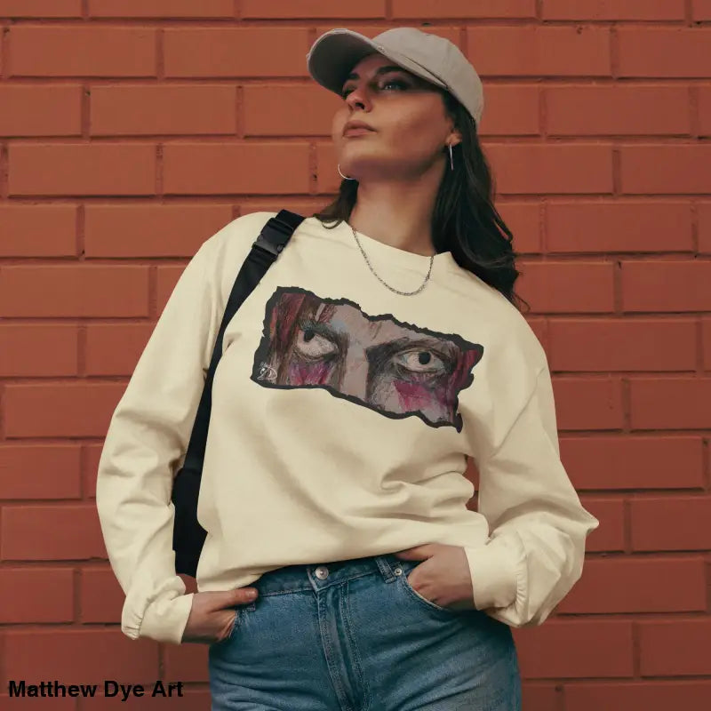Woman in a graphic sweatshirt from Watcher’s Veil, an elegant premium long sleeve