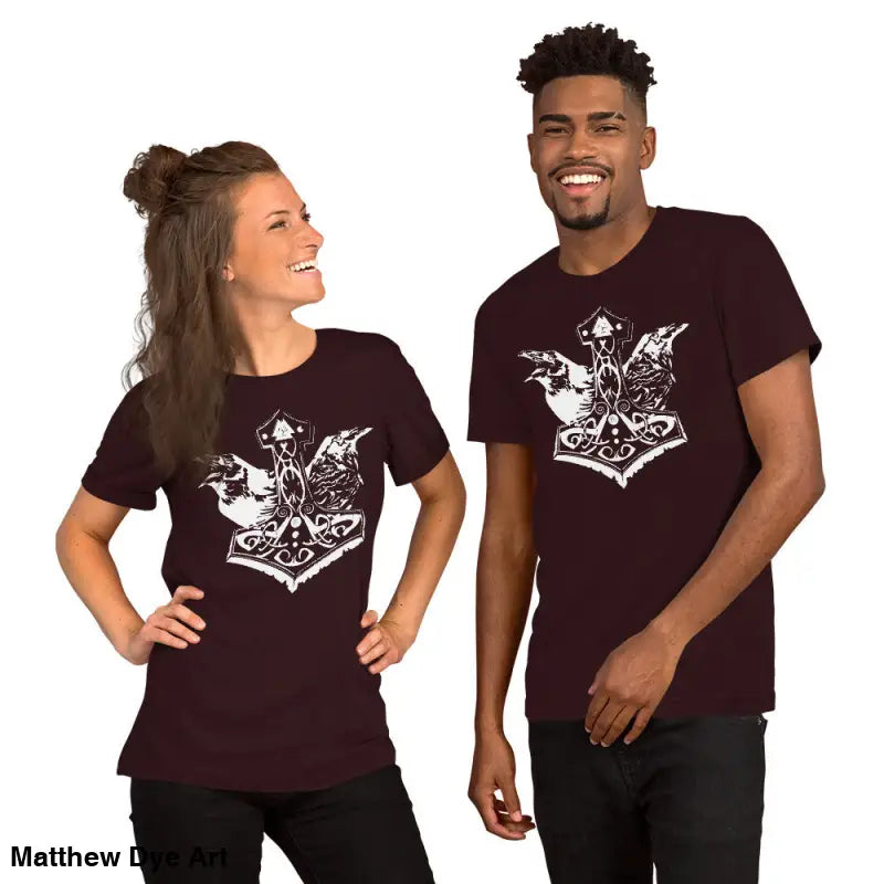 Two people in matching maroon Viking pride t-shirts with white Thor’s hammer design