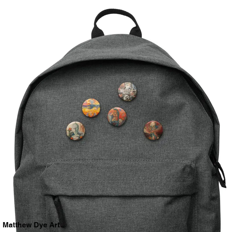 Grey backpack adorned with decorative pins from the Treasure Trove pin set
