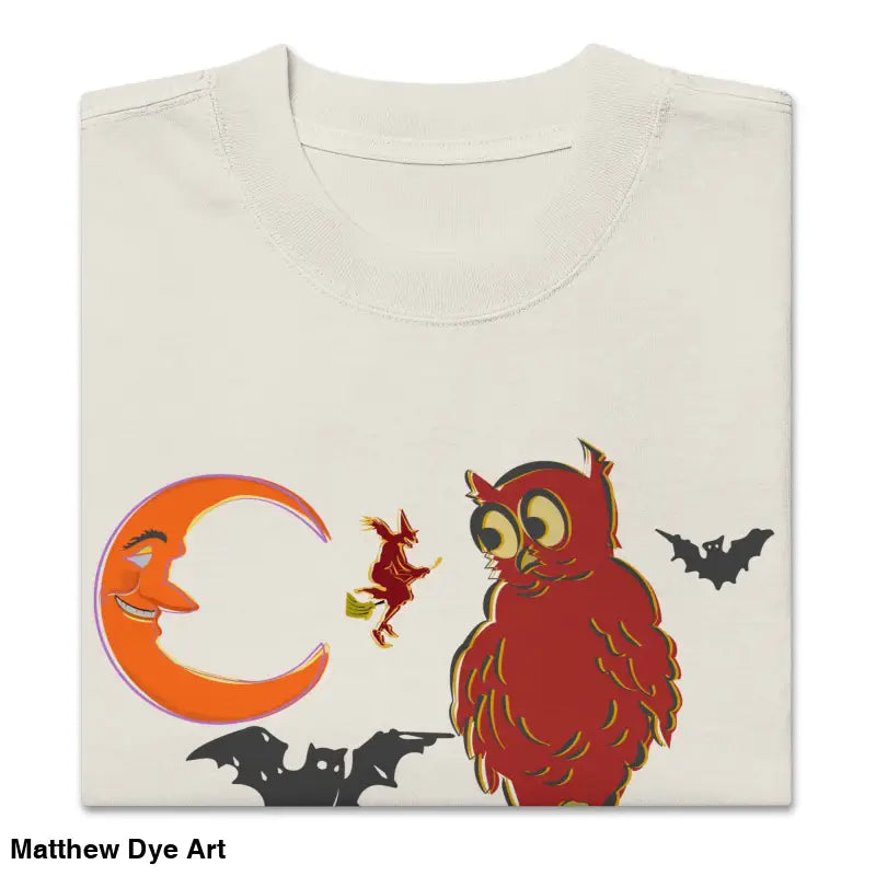 Folded oversized faded t-shirt featuring Witching Hour Watcher design for haunted harvest