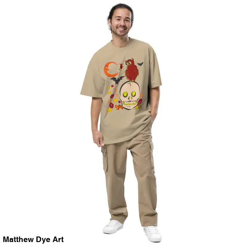 Man in a tan outfit wearing an Oversized Faded Halloween T-Shirt with faded t-shirt elegance