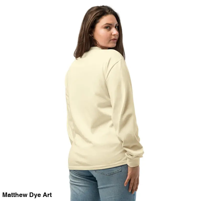 Woman in a long-sleeved shirt featuring a Halloween owl and skull design