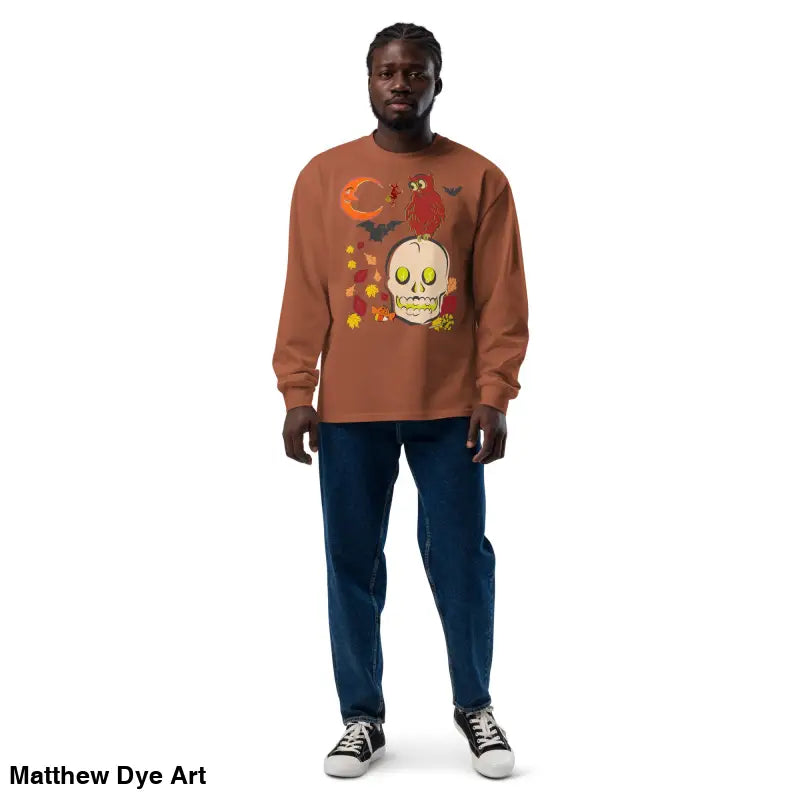 Man in a Halloween-themed sweatshirt featuring an owl and skull design