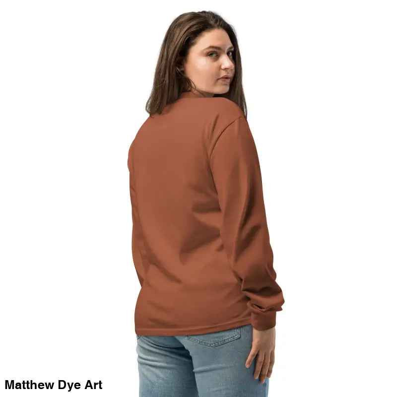 Woman in a brown long-sleeved shirt featuring Halloween owl and skull design